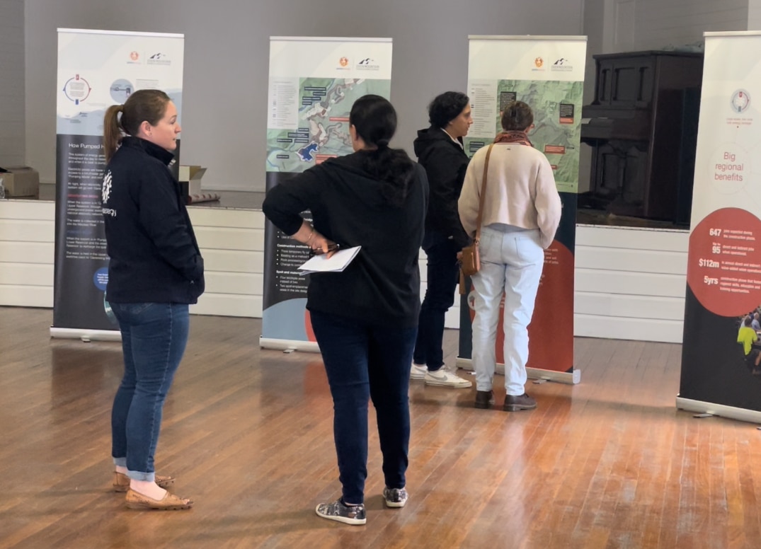 Alinta Energy's Community Engagement Manager talks to stakeholders at a project drop-in session.